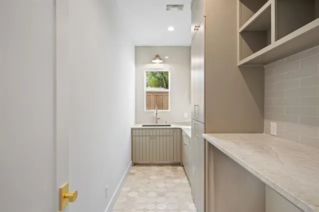 a hallway with sink and window