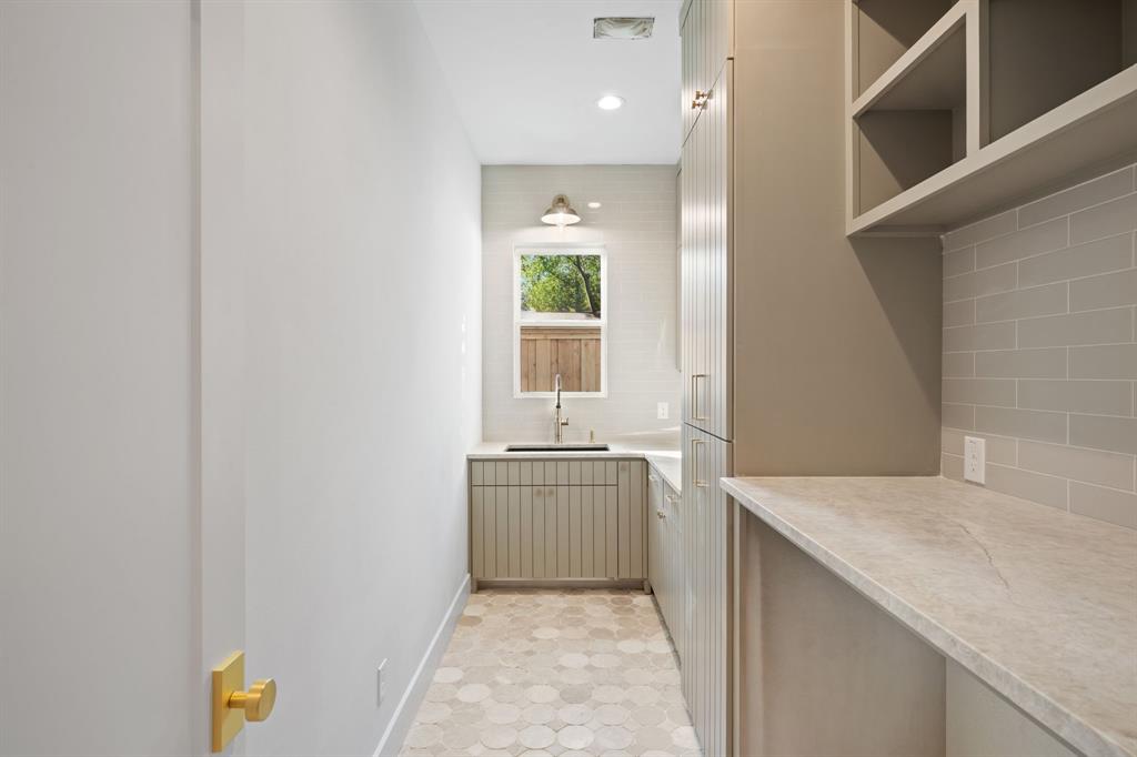 3341 Dothan Lane Dallas, TX 75229 - Photo 11 of 13 a hallway with sink and window