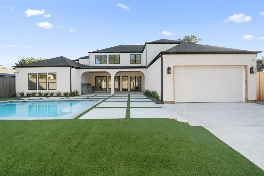 3341 Dothan Lane Dallas, TX 75229 - Photo 13 of 13 a front view of a house with a yard and garage