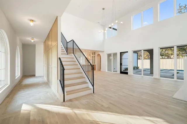 a view of entryway and hall with wooden floor