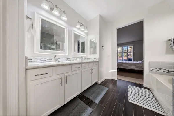 a view of house with yard and tree in front of it