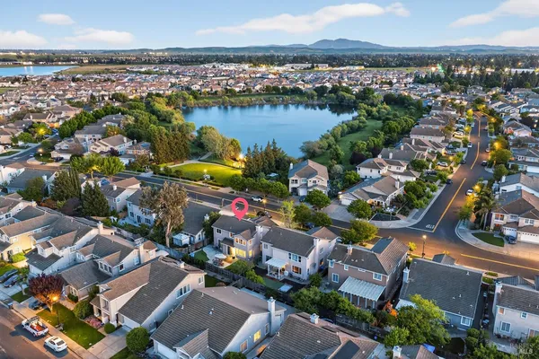an aerial view of residential houses with yard
