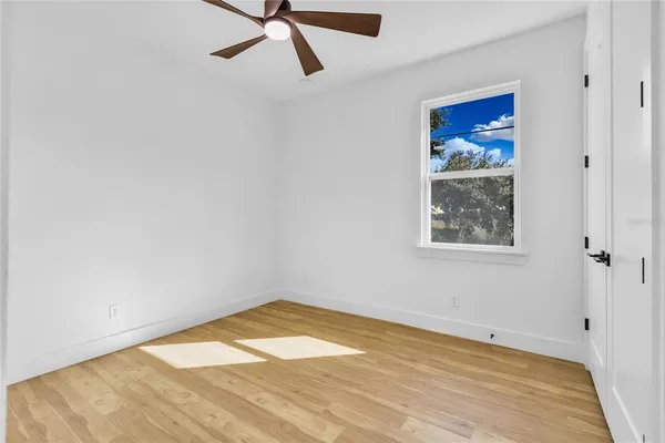 a view of a room with a wooden floor