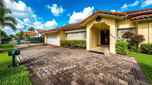 a front view of a house with a yard