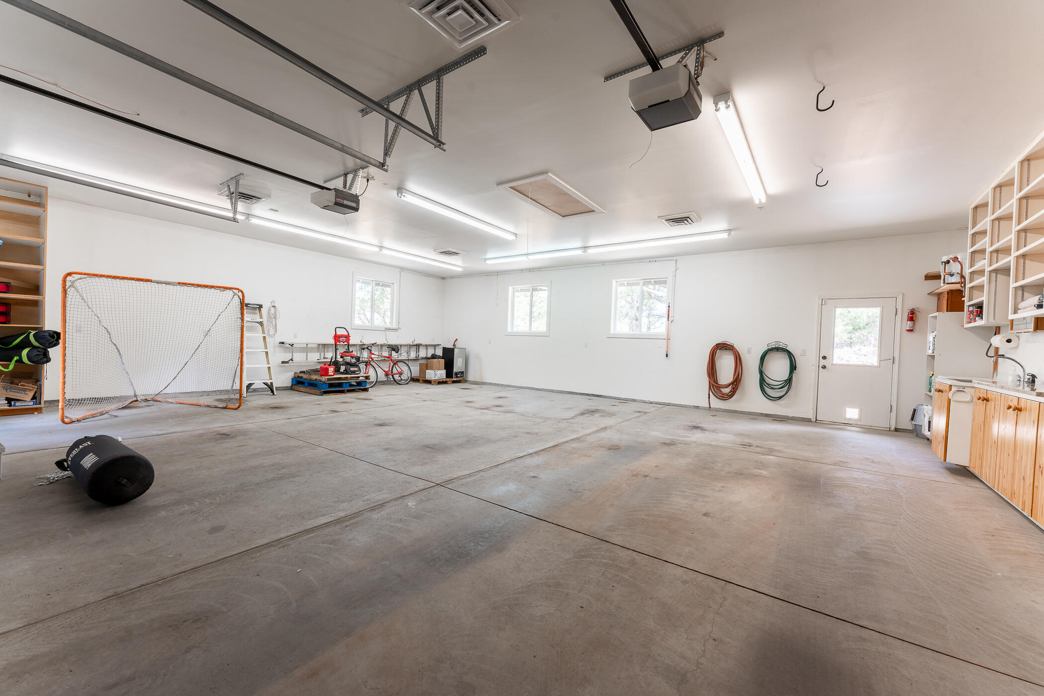 64300 Crosswinds Road Bend, OR 97703 - Photo 46 of 61 Massive, oversized garage is heated and has water and an electric vehicle charging station.