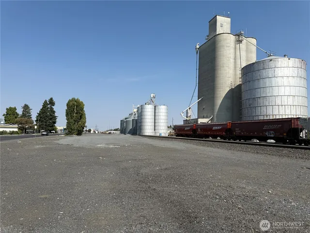 a couple of cars parked in front of a building