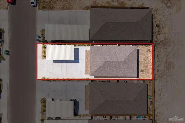 an aerial view of house with a swimming pool