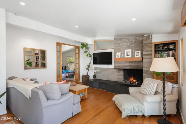 a living room with furniture and a fireplace
