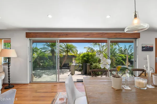 a view of a dining room with furniture window and outside view
