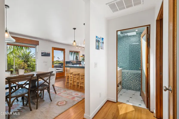 a view of a dining room with furniture window and wooden floor