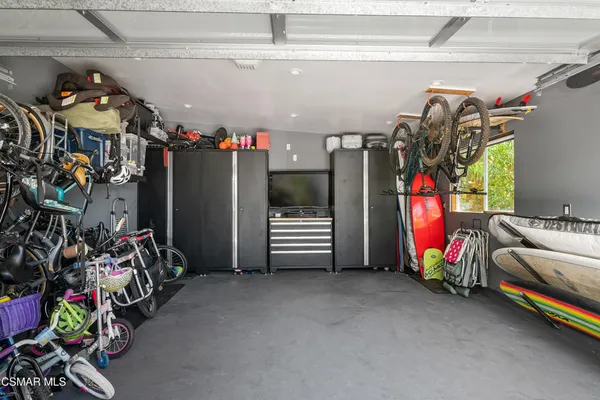 a view of a garage with a lot of stuff