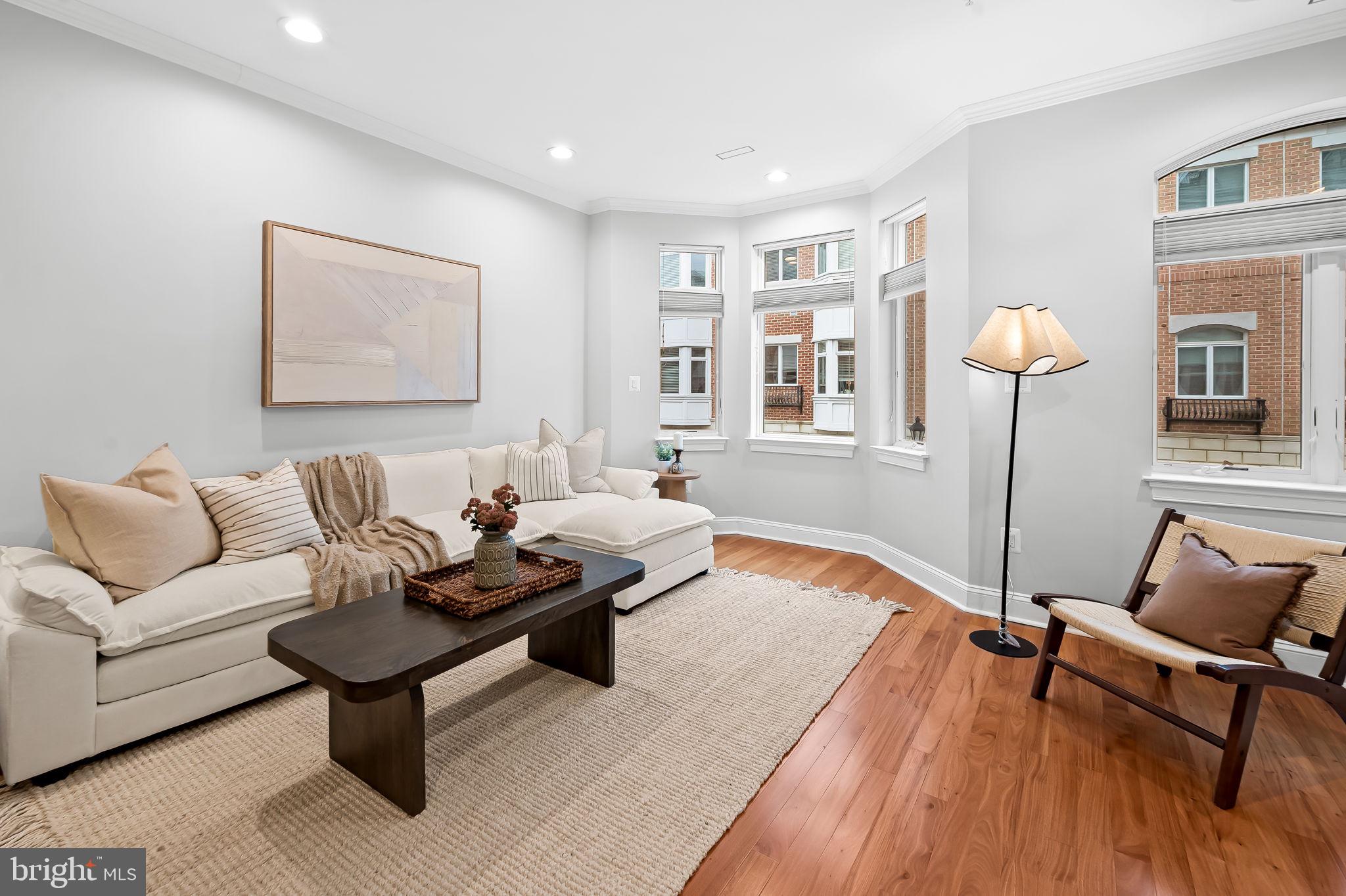 1024 Pier Pointe Landing, Unit 107 Baltimore, MD 21230 - Photo 12 of 51 a living room with furniture and wooden floor