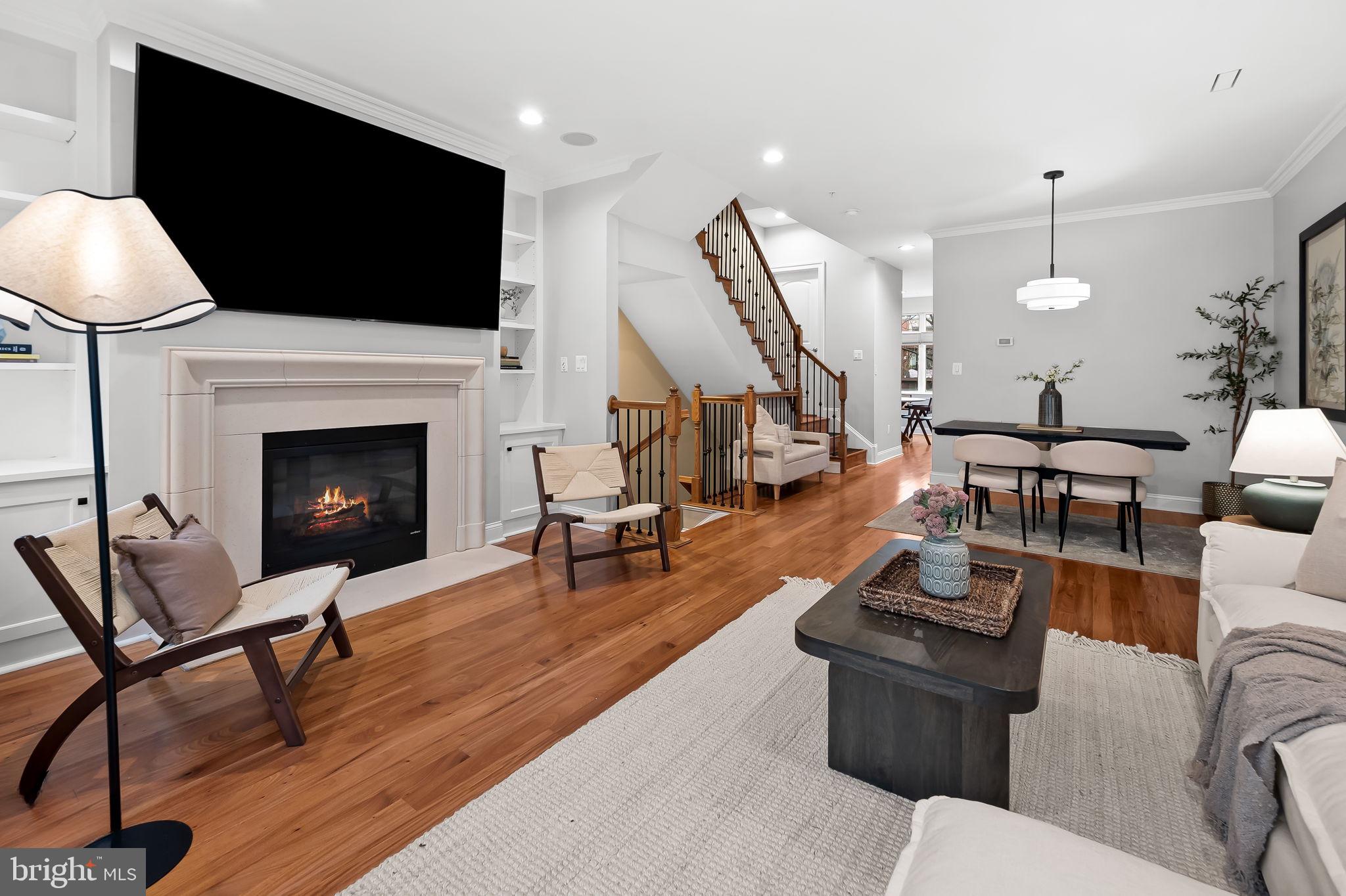 1024 Pier Pointe Landing, Unit 107 Baltimore, MD 21230 - Photo 14 of 51 a living room with furniture fireplace and a flat screen tv