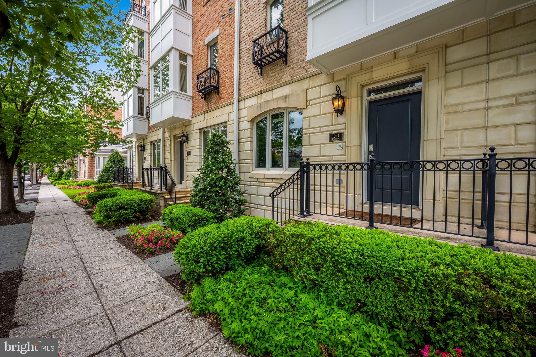 1024 Pier Pointe Landing, Unit 107 Baltimore, MD 21230 - Photo 2 of 51 a view of a pathway with a house