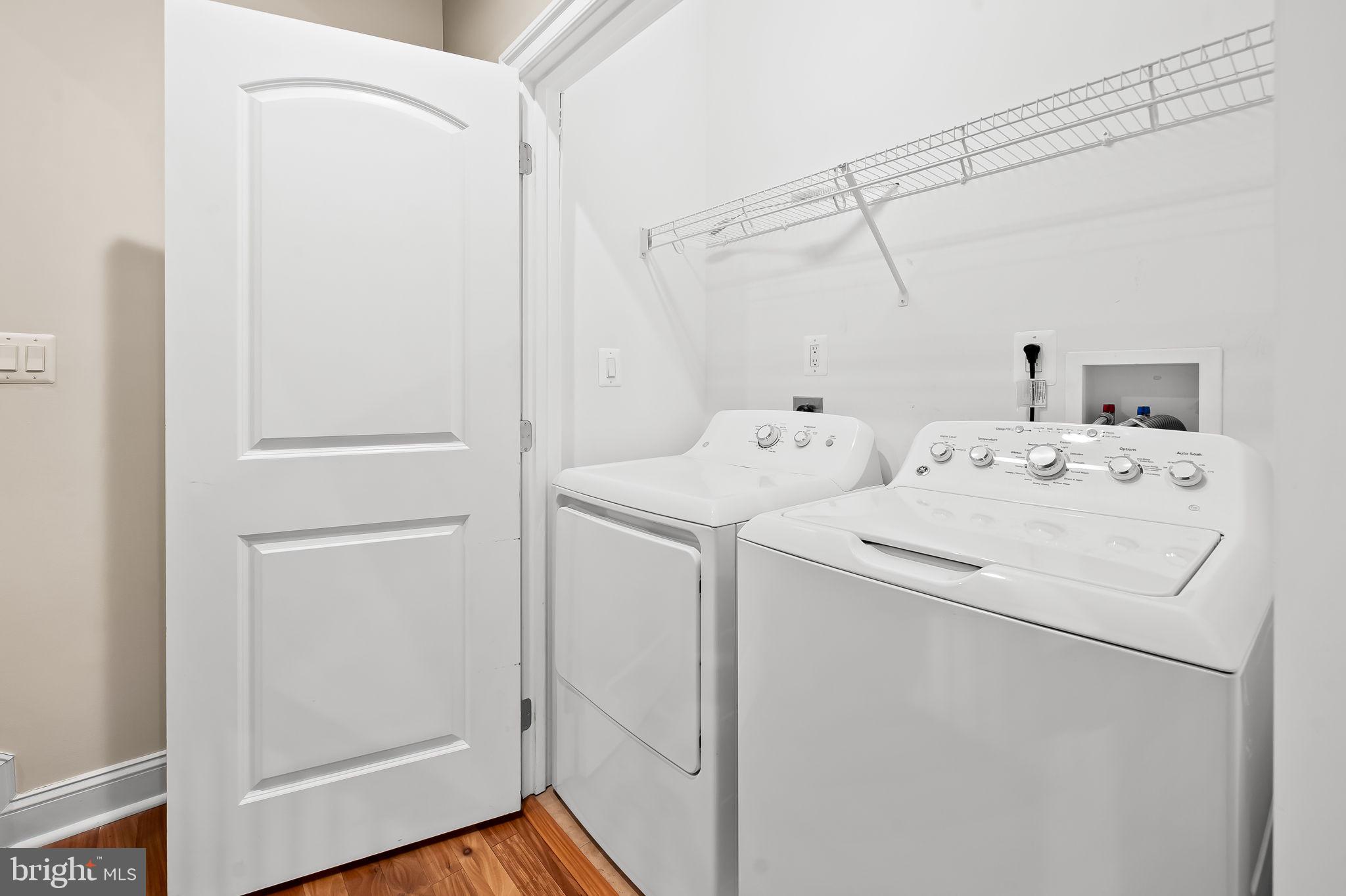 1024 Pier Pointe Landing, Unit 107 Baltimore, MD 21230 - Photo 25 of 51 a utility room with dryer and washer