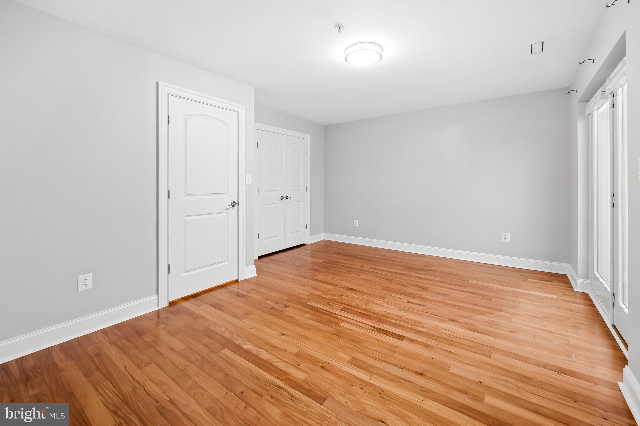 1024 Pier Pointe Landing, Unit 107 Baltimore, MD 21230 - Photo 26 of 51 a view of empty room with wooden floor