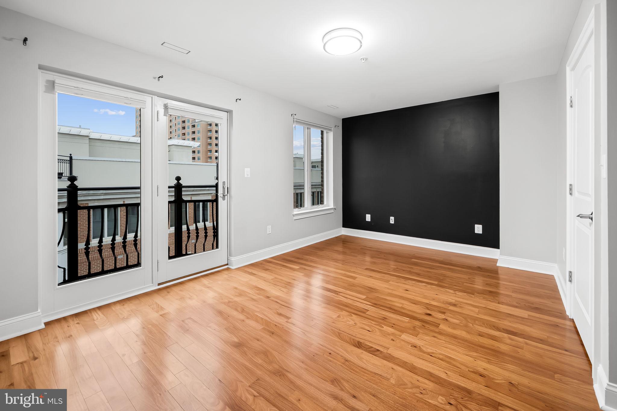 1024 Pier Pointe Landing, Unit 107 Baltimore, MD 21230 - Photo 27 of 51 a view of empty room with wooden floor
