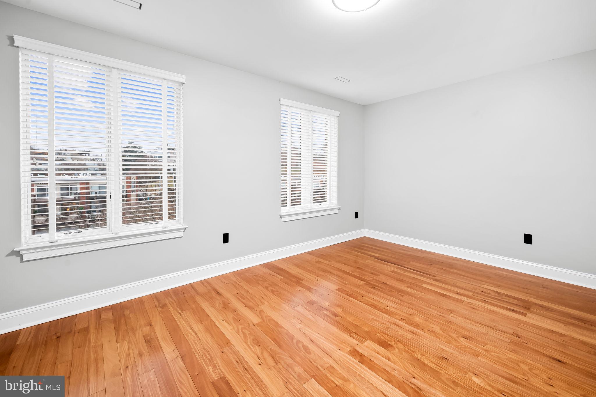 1024 Pier Pointe Landing, Unit 107 Baltimore, MD 21230 - Photo 29 of 51 a view of an empty room with wooden floor and a window
