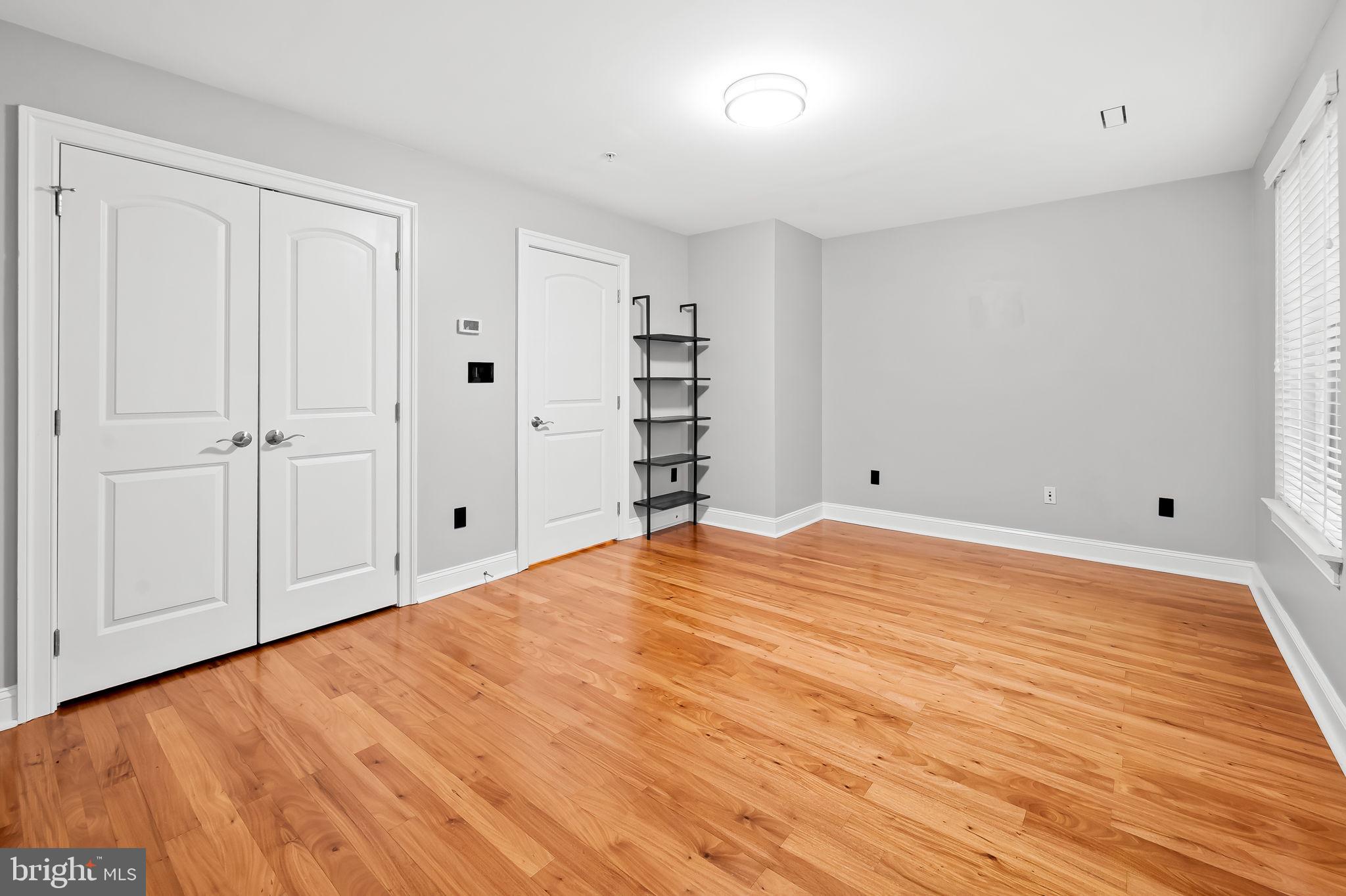 1024 Pier Pointe Landing, Unit 107 Baltimore, MD 21230 - Photo 30 of 51 a view of empty room with wooden floor