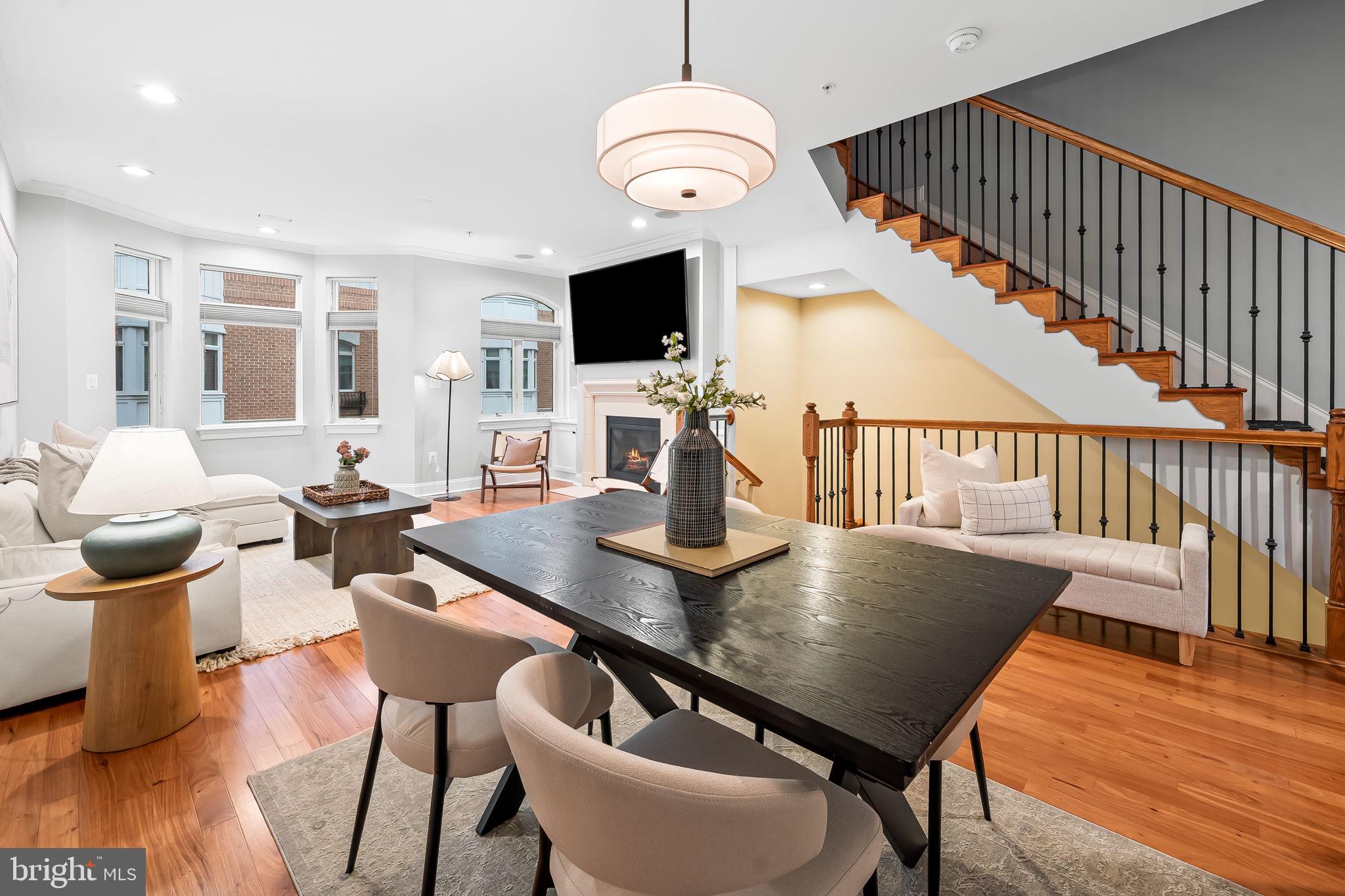 1024 Pier Pointe Landing, Unit 107 Baltimore, MD 21230 - Photo 3 of 51 a view of a dining room with furniture wooden floor and chandelier
