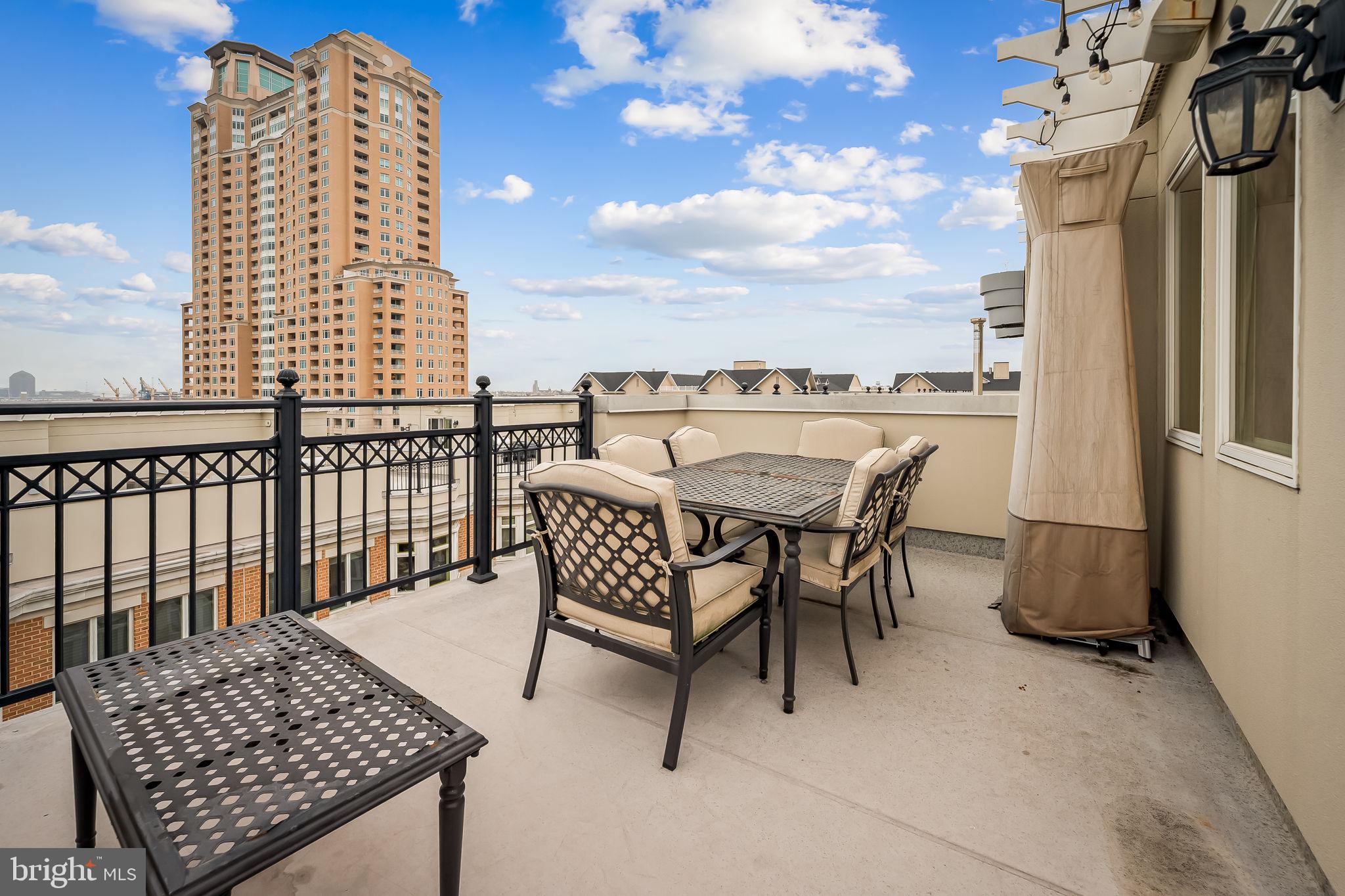 1024 Pier Pointe Landing, Unit 107 Baltimore, MD 21230 - Photo 34 of 51 a view of a roof deck with furniture