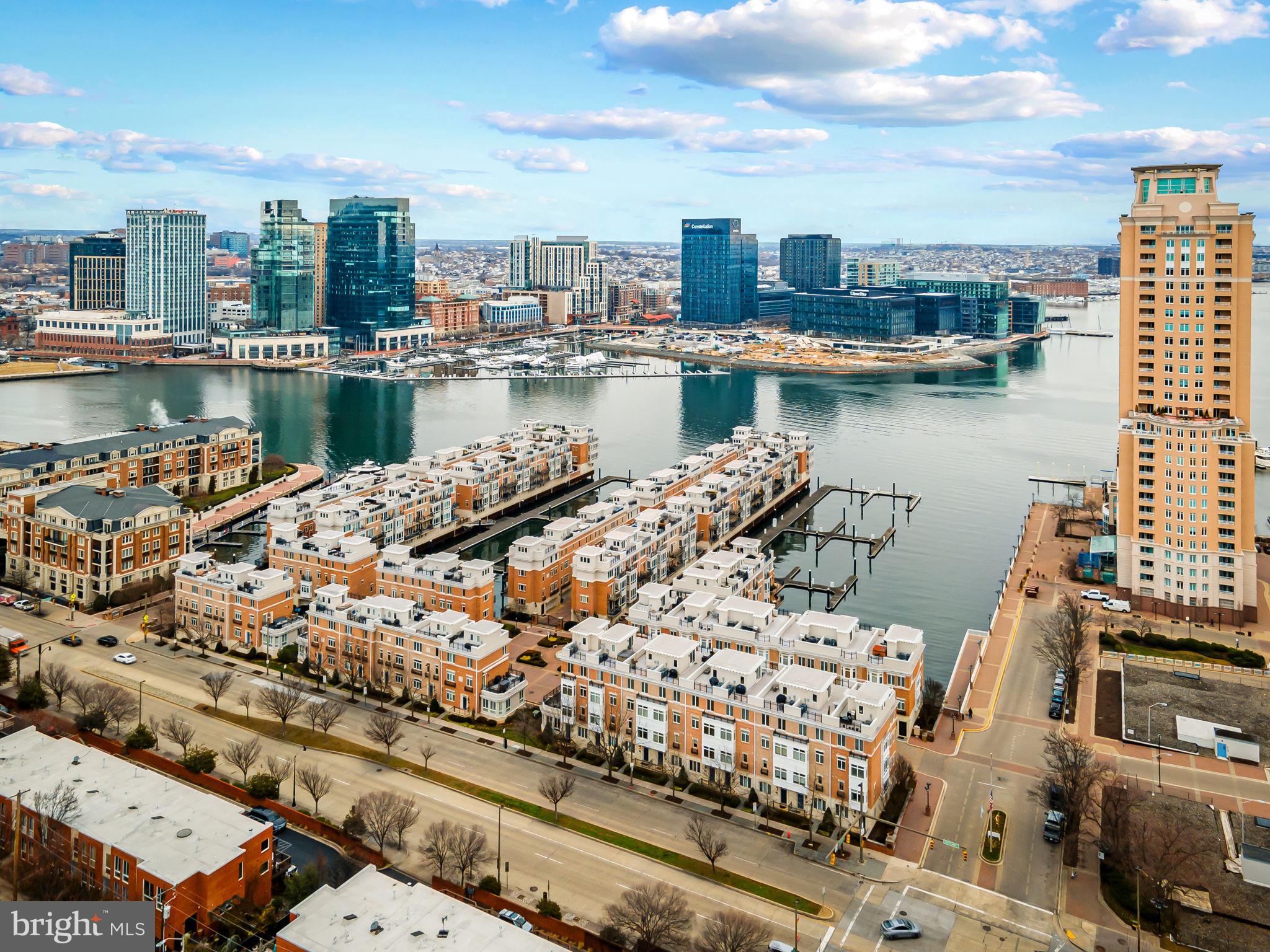 1024 Pier Pointe Landing, Unit 107 Baltimore, MD 21230 - Photo 43 of 51 a view of a lake with tall buildings