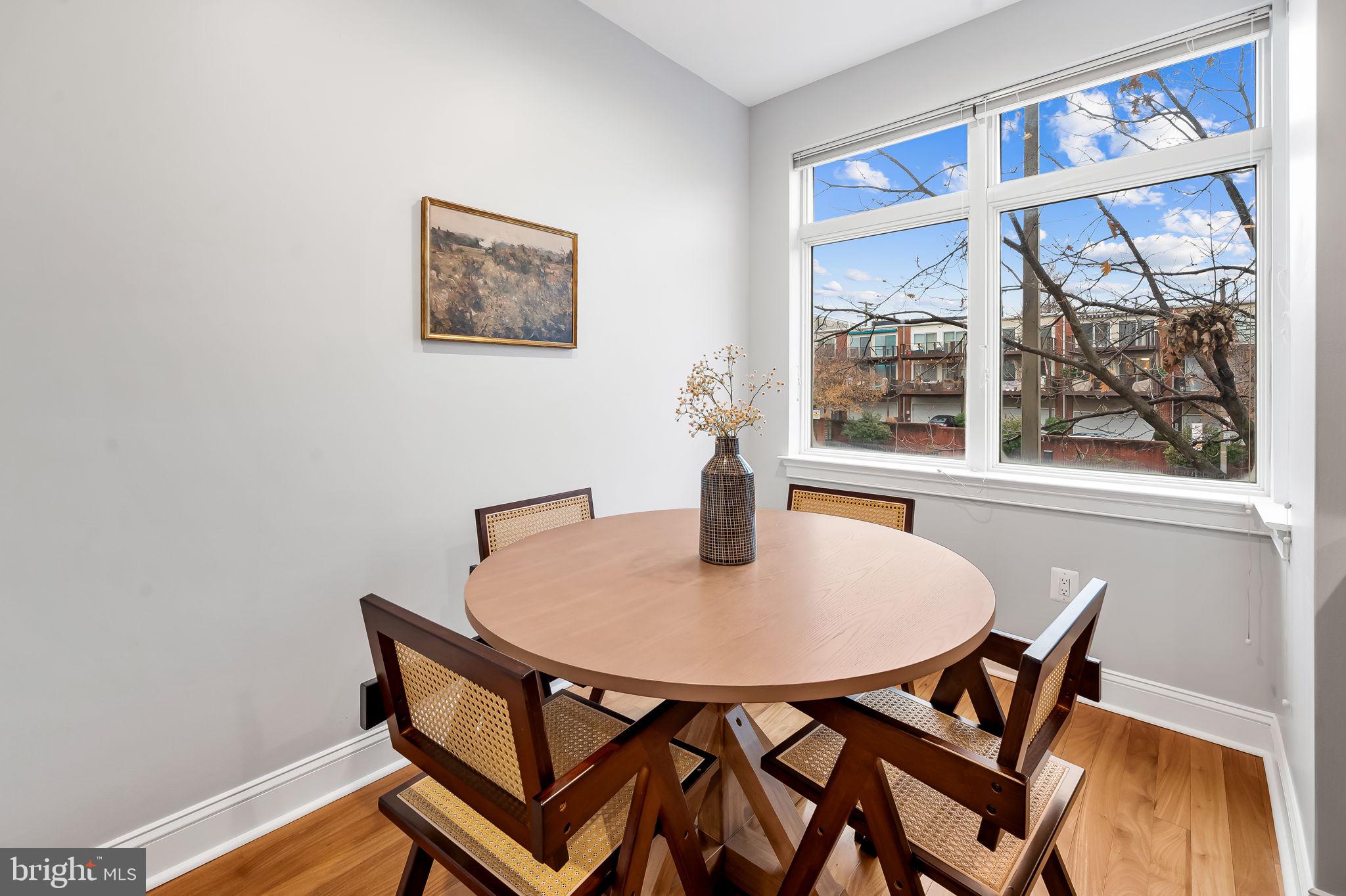 1024 Pier Pointe Landing, Unit 107 Baltimore, MD 21230 - Photo 5 of 51 a dining room with furniture and window