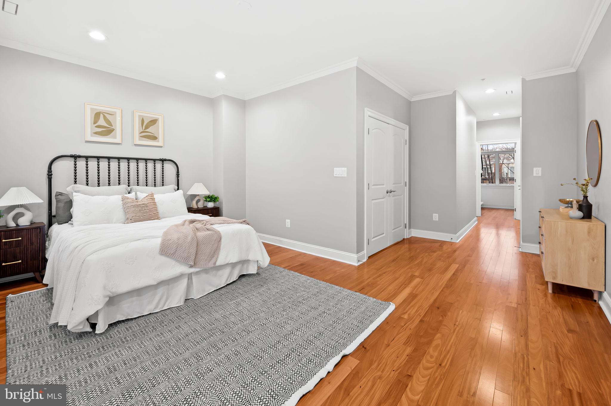 1024 Pier Pointe Landing, Unit 107 Baltimore, MD 21230 - Photo 6 of 51 a bedroom with a bed and a view of bathroom