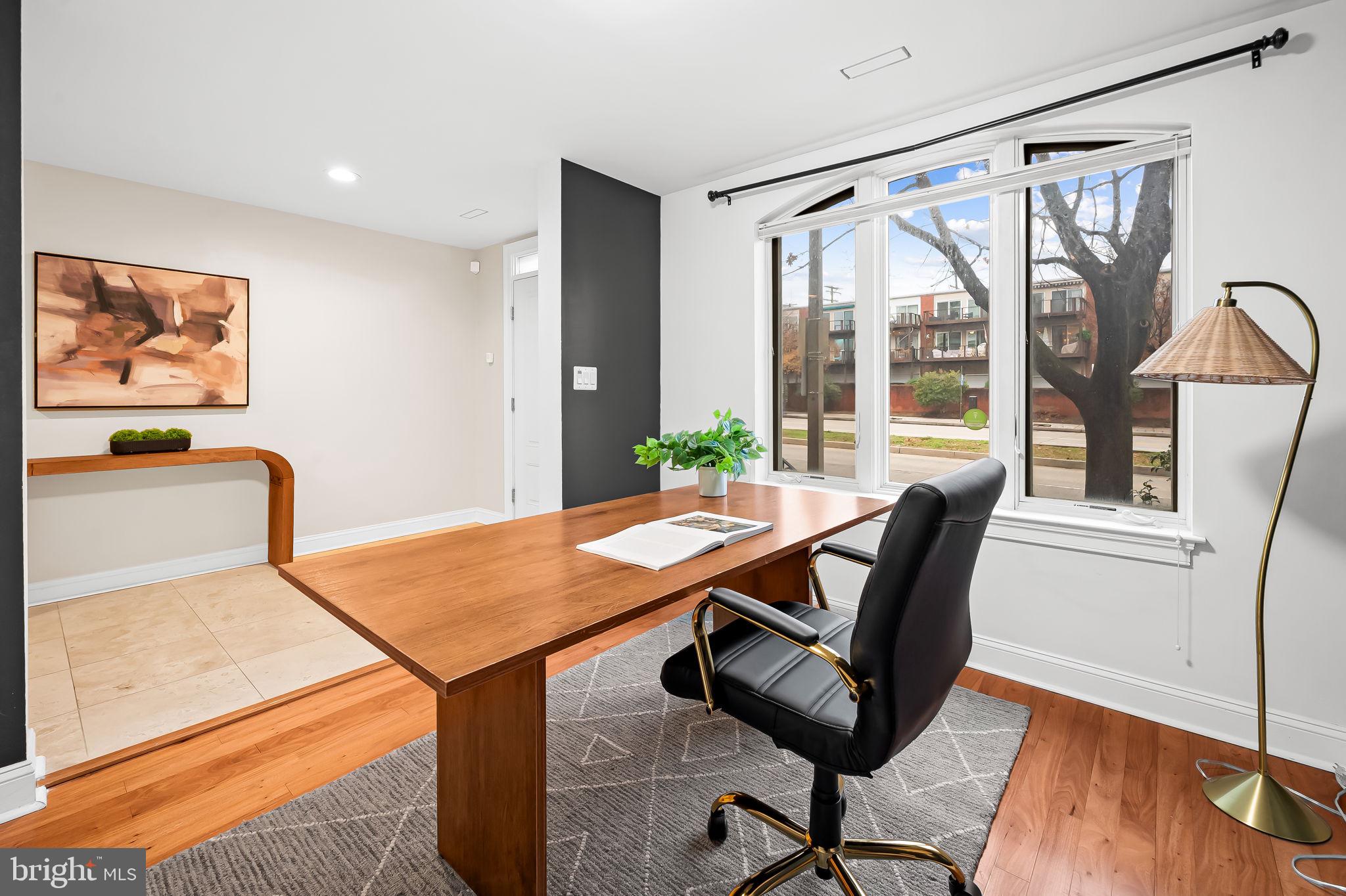 1024 Pier Pointe Landing, Unit 107 Baltimore, MD 21230 - Photo 10 of 51 a view of a workspace with furniture and a window