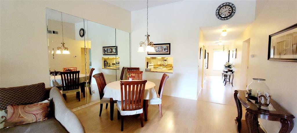 3505 Tarpon Woods Boulevard, Unit P408 Palm Harbor, FL 34685 - Photo 12 of 22 a view of a dining room with furniture