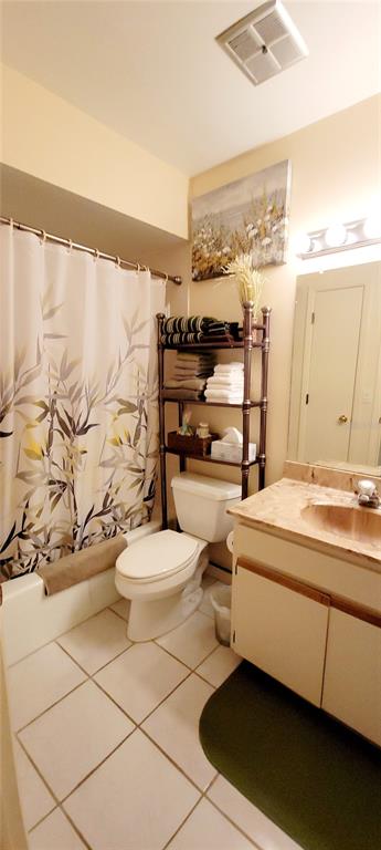 3505 Tarpon Woods Boulevard, Unit P408 Palm Harbor, FL 34685 - Photo 16 of 22 a bathroom with a sink a toilet and shower