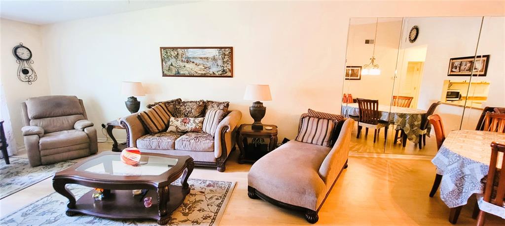 3505 Tarpon Woods Boulevard, Unit P408 Palm Harbor, FL 34685 - Photo 18 of 22 a living room with furniture and a rug