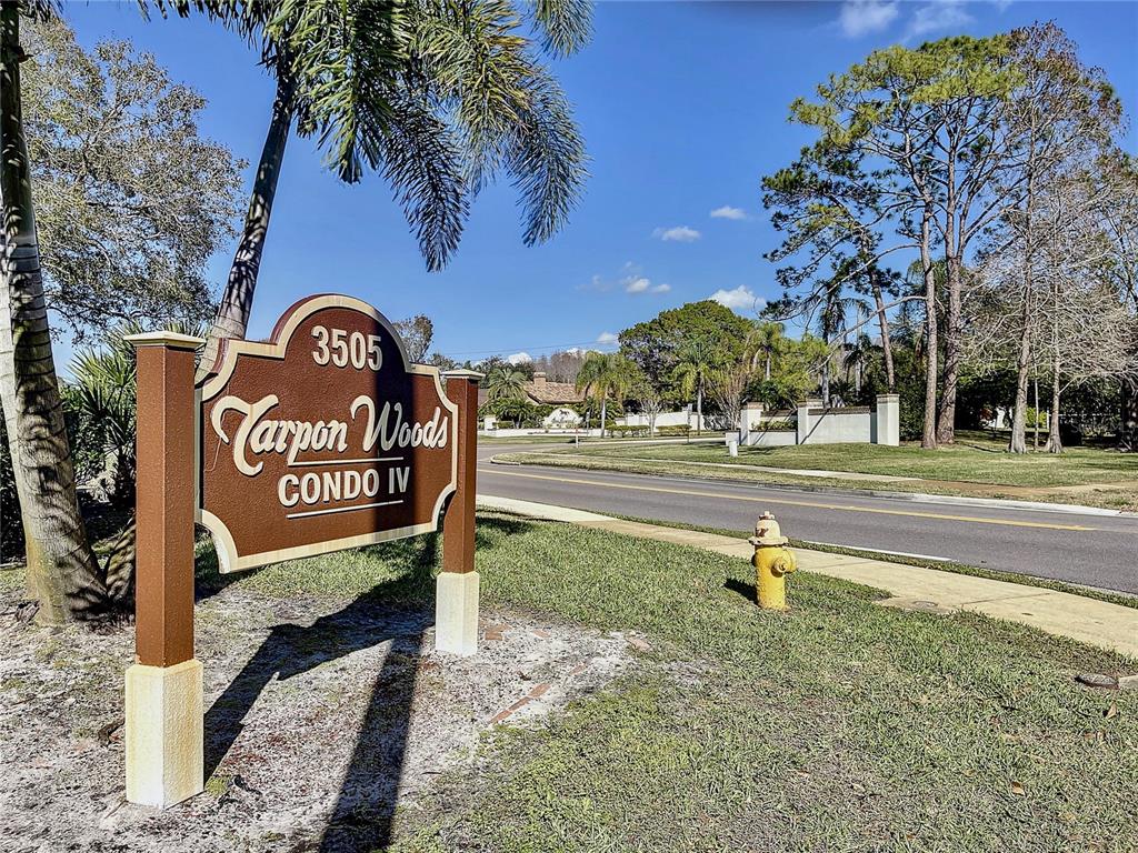 3505 Tarpon Woods Boulevard, Unit P408 Palm Harbor, FL 34685 - Photo 19 of 22 a sign that is on the side of the road