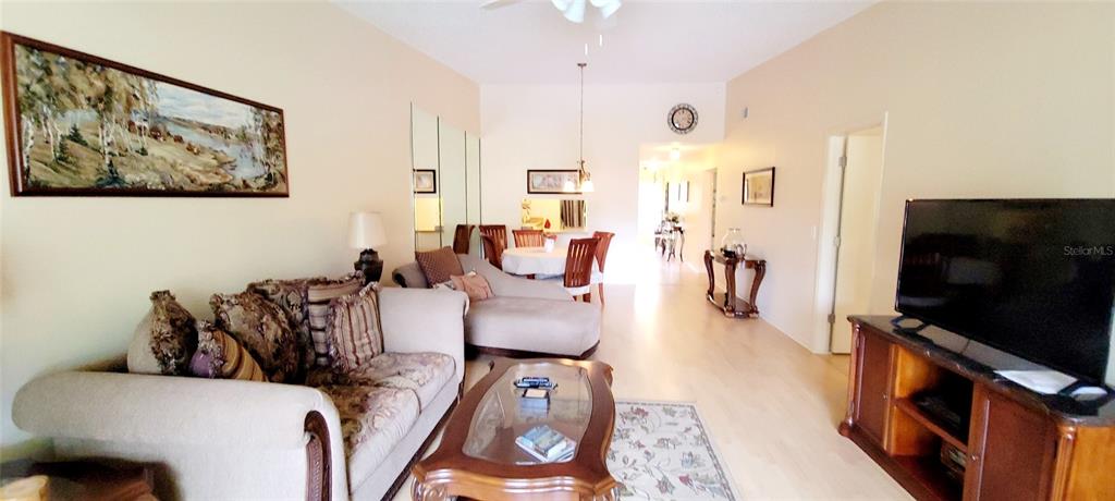 3505 Tarpon Woods Boulevard, Unit P408 Palm Harbor, FL 34685 - Photo 10 of 22 a living room with furniture and a flat screen tv