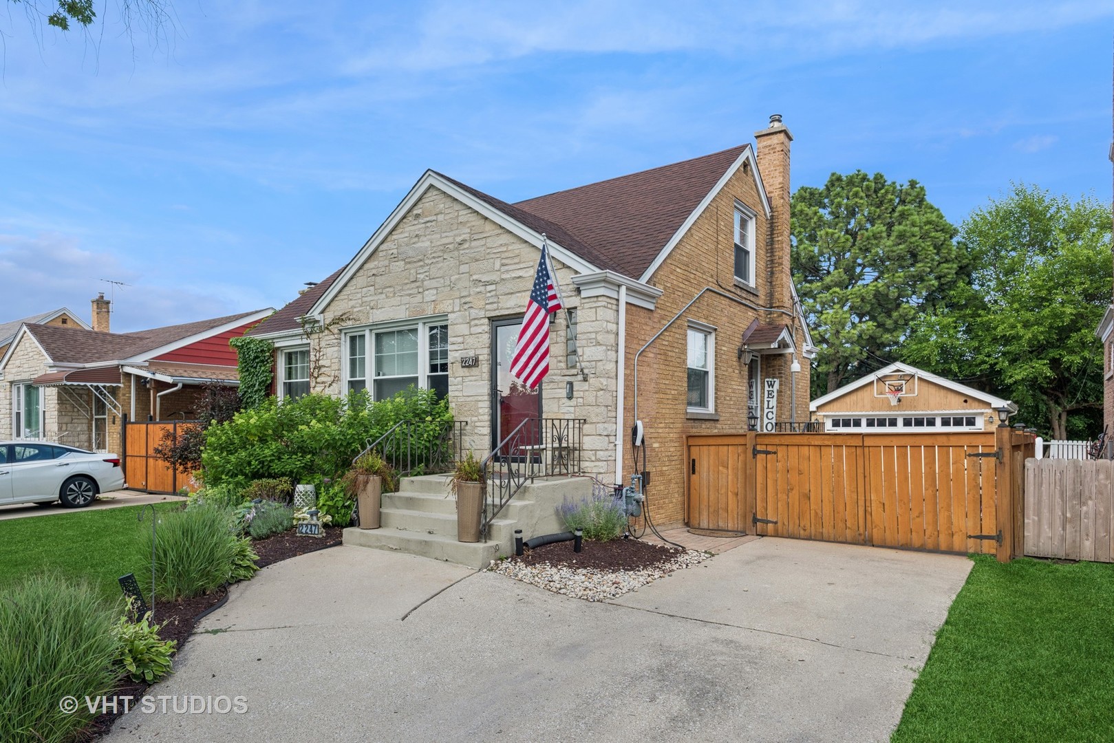2247 South 7th Avenue North Riverside, IL 60546 - Photo 3 of 23 a front view of a house with a yard and garage