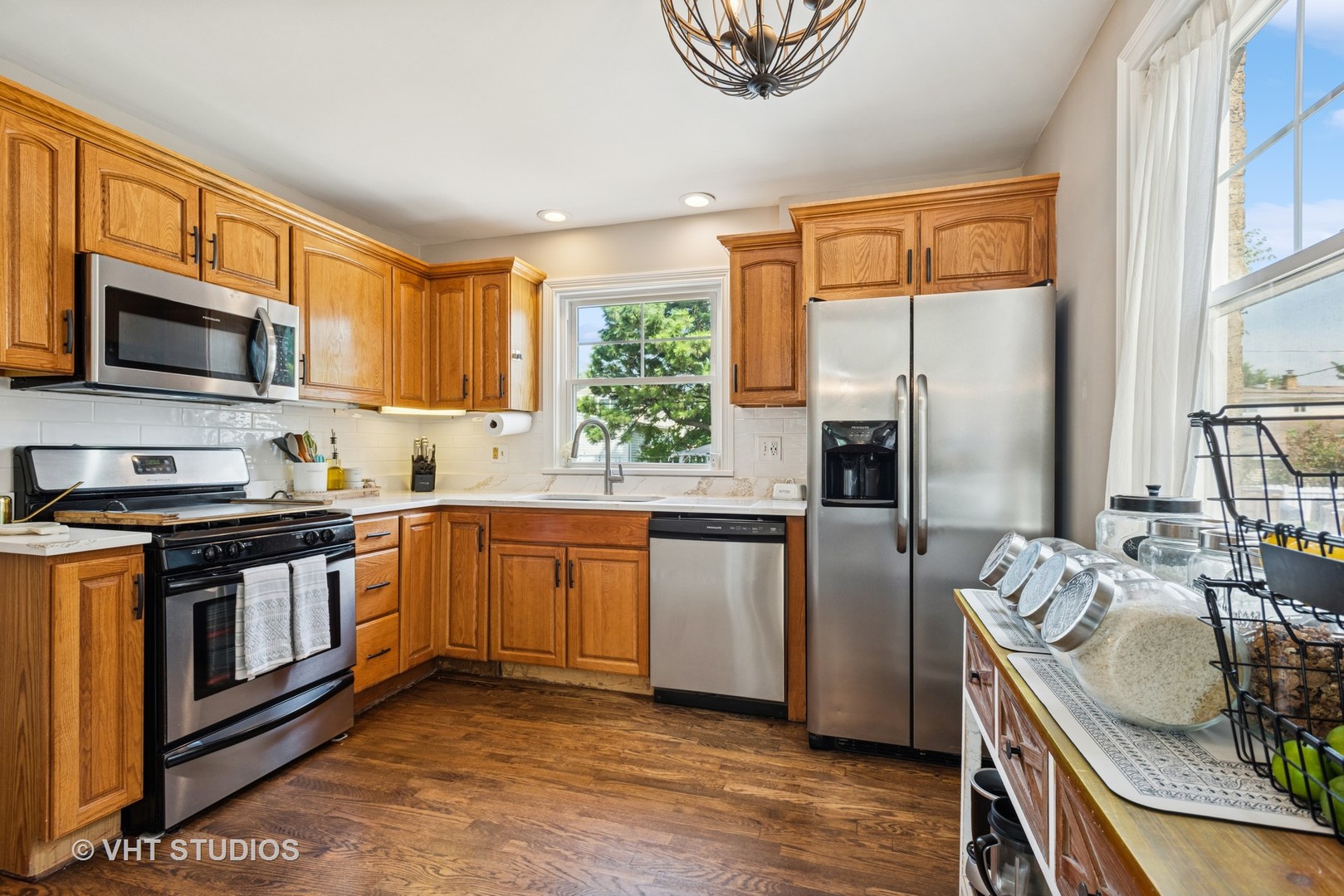 2247 South 7th Avenue North Riverside, IL 60546 - Photo 8 of 23 a kitchen with stainless steel appliances granite countertop a stove a sink and a microwave
