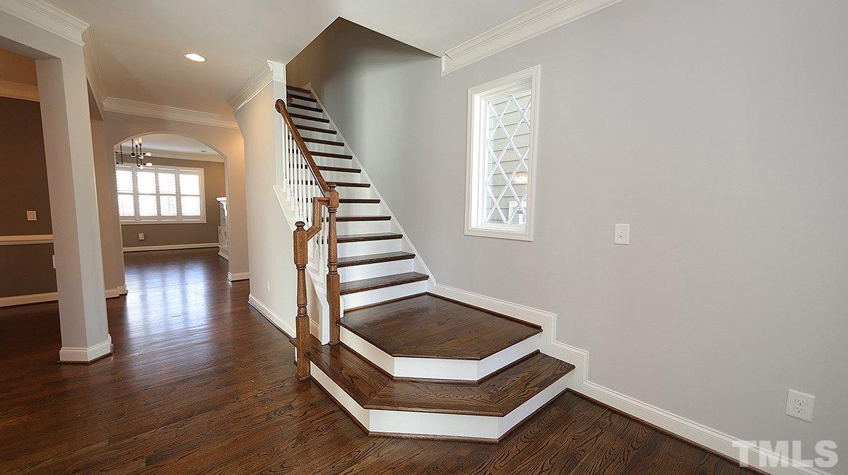 1541 Fullerton Place Raleigh, NC 27607 - Photo 2 of 29 an entryway with wooden floor and windows