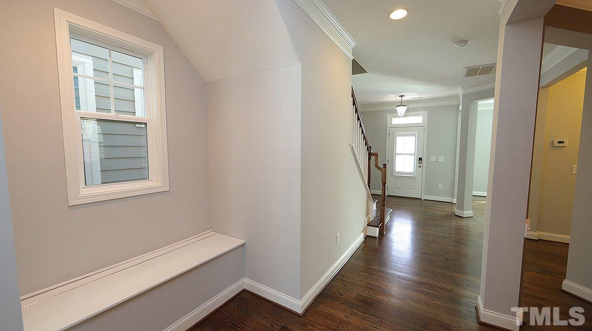 1541 Fullerton Place Raleigh, NC 27607 - Photo 12 of 29 a view of a hallway with wooden floor and closet