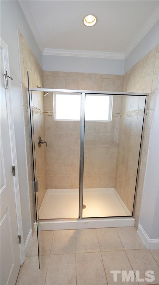 1541 Fullerton Place Raleigh, NC 27607 - Photo 16 of 29 a bathroom with a glass shower door
