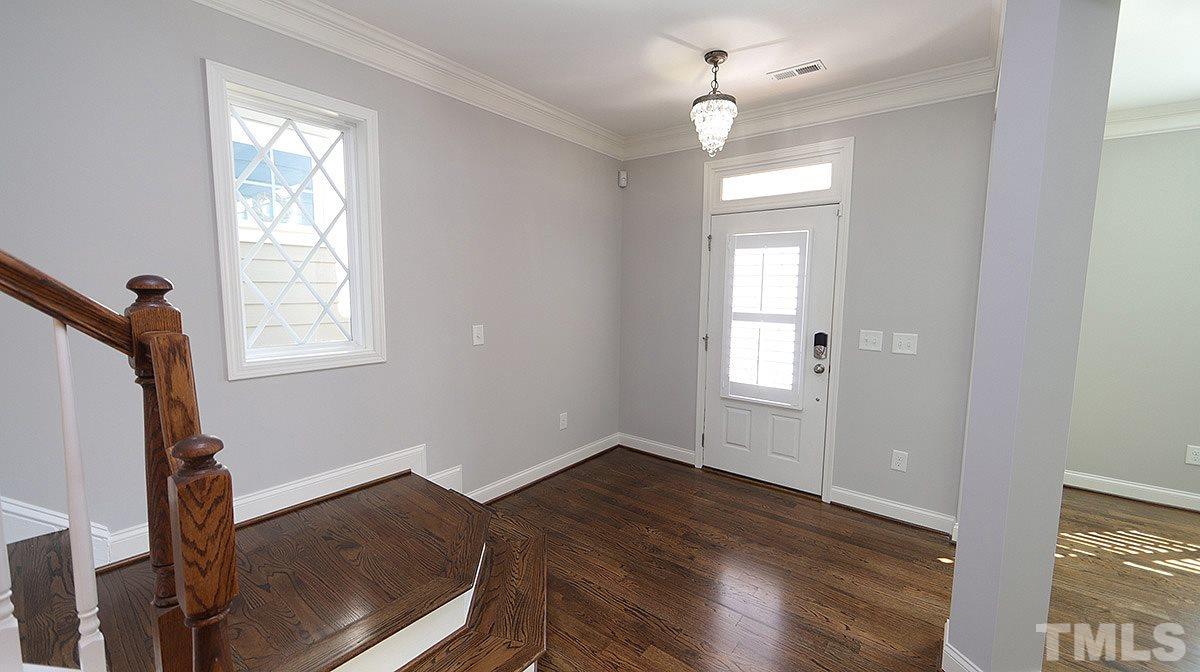 1541 Fullerton Place Raleigh, NC 27607 - Photo 3 of 29 a view of empty room with wooden floor and fan