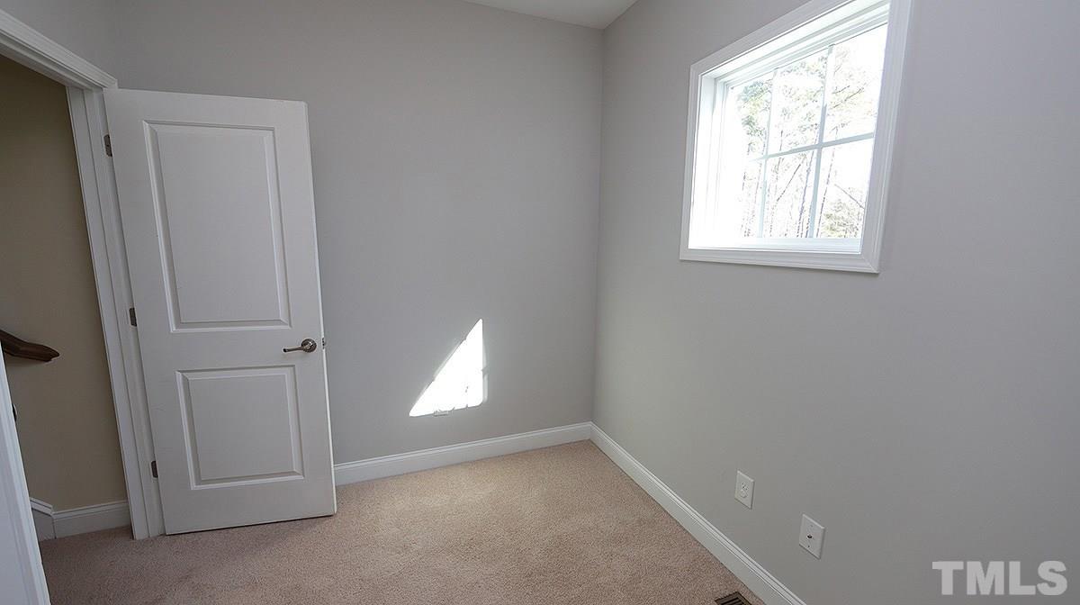 1541 Fullerton Place Raleigh, NC 27607 - Photo 21 of 29 an empty room with windows