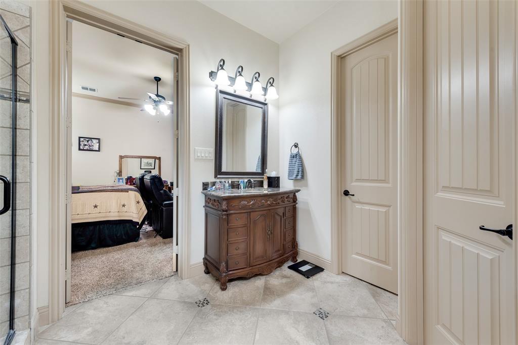 5056 Empire Way Irving, TX 75038 - Photo 15 of 39 Downstairs Primary bathroom #1 with large walk in closet