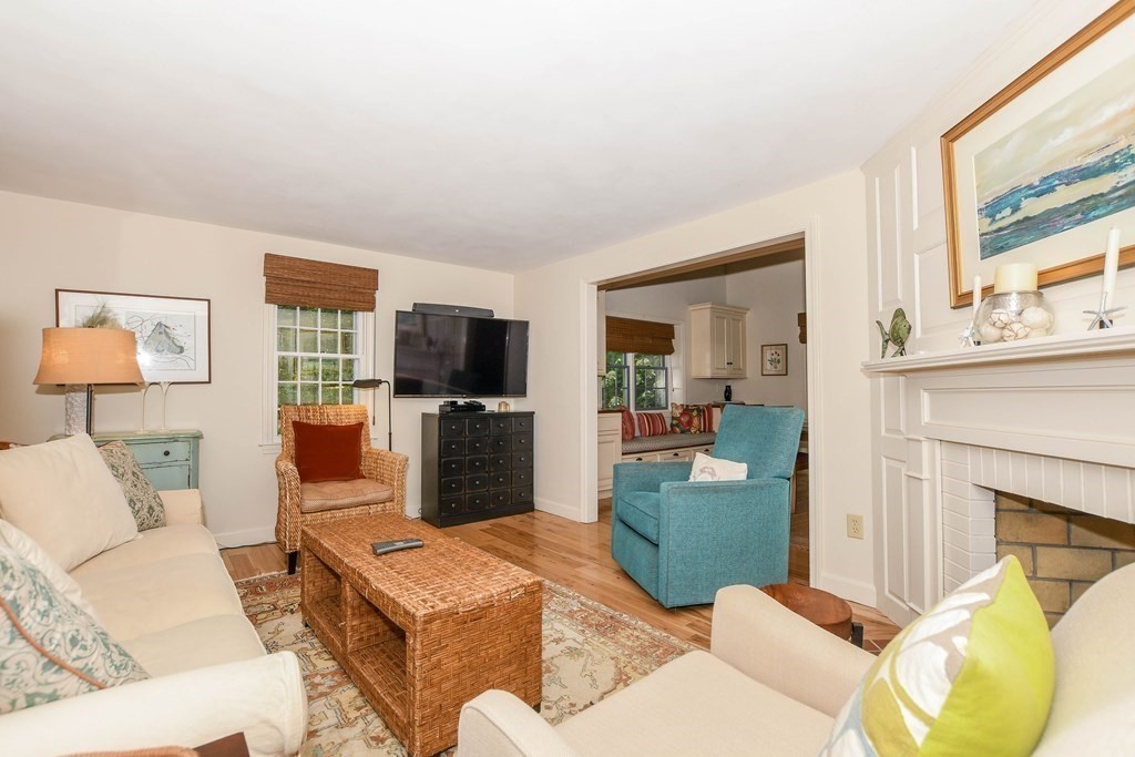 34 Register Road Marion, MA 02738 - Photo 19 of 42 a living room with furniture a flat screen tv and a fireplace