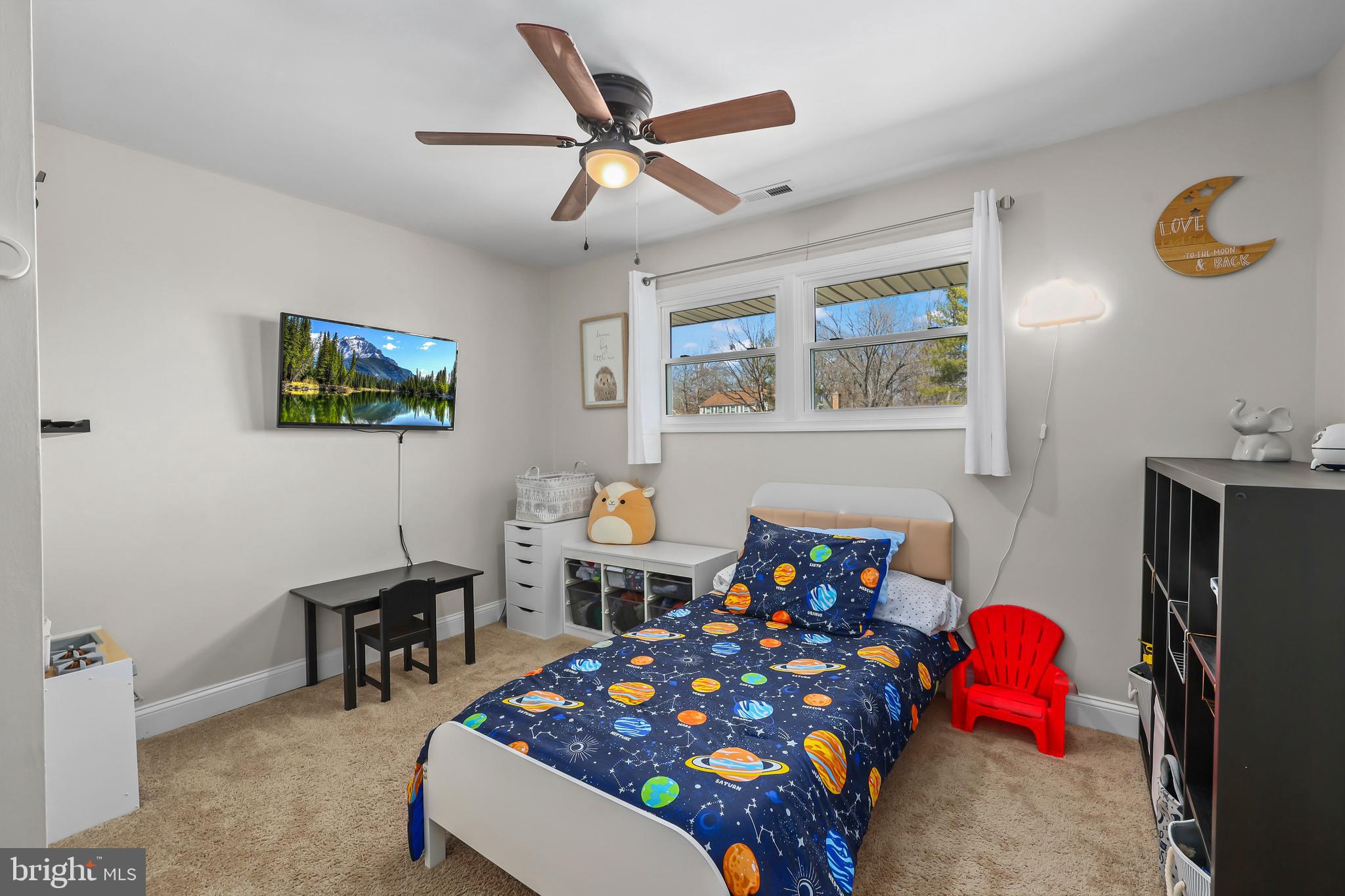 379 Ferry Road Fredericksburg, VA 22405 - Photo 18 of 33 a bedroom with a bed and a chandelier