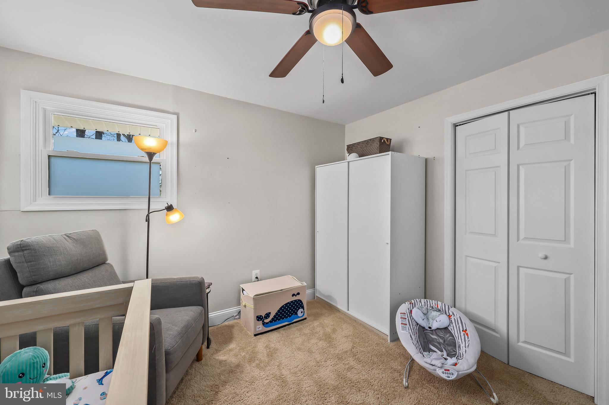 379 Ferry Road Fredericksburg, VA 22405 - Photo 21 of 33 a bedroom with furniture and a chandelier