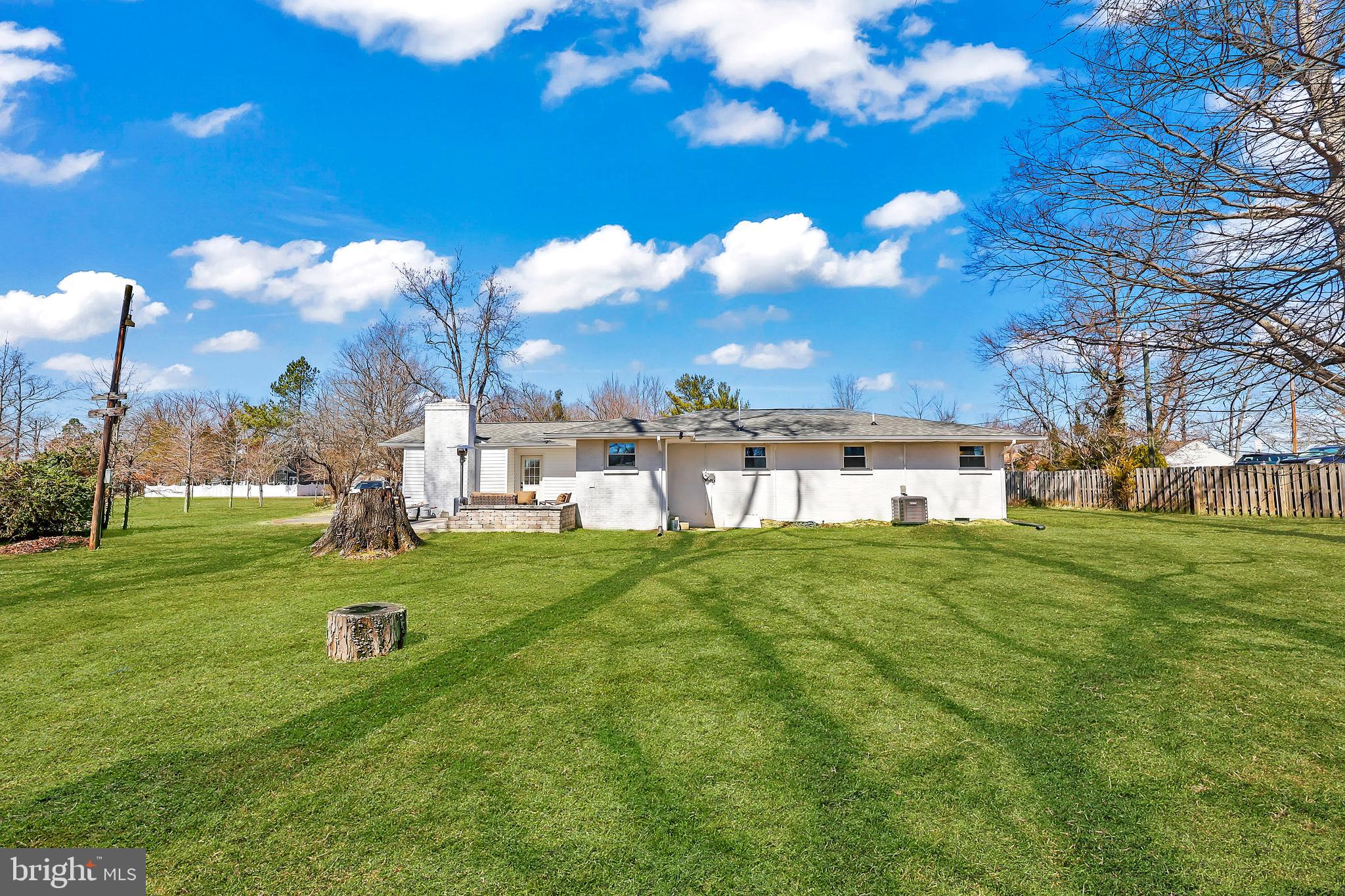 379 Ferry Road Fredericksburg, VA 22405 - Photo 28 of 33 a view of a big yard of a house with table and chairs