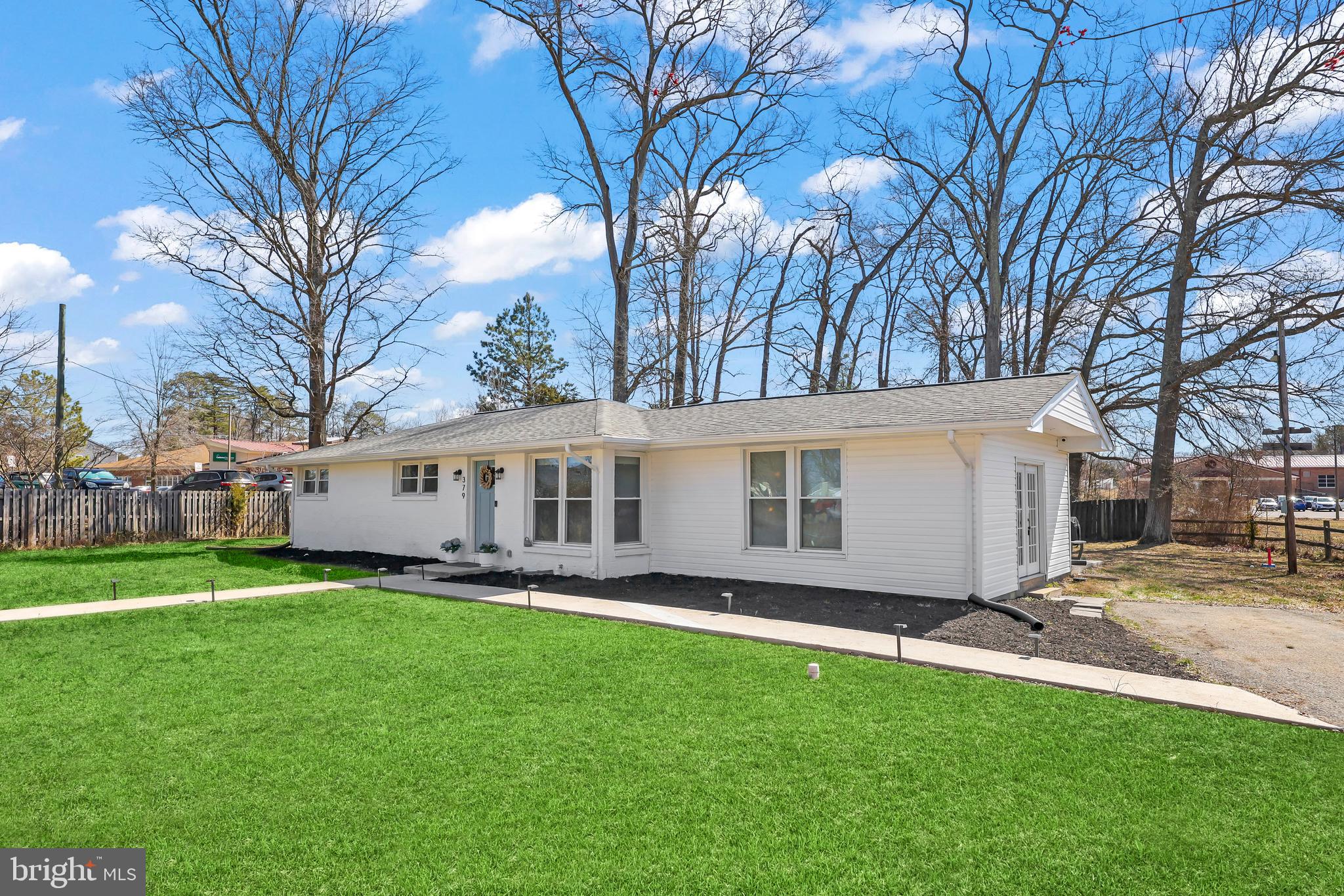 379 Ferry Road Fredericksburg, VA 22405 - Photo 30 of 33 a view of a house with a big yard and large trees