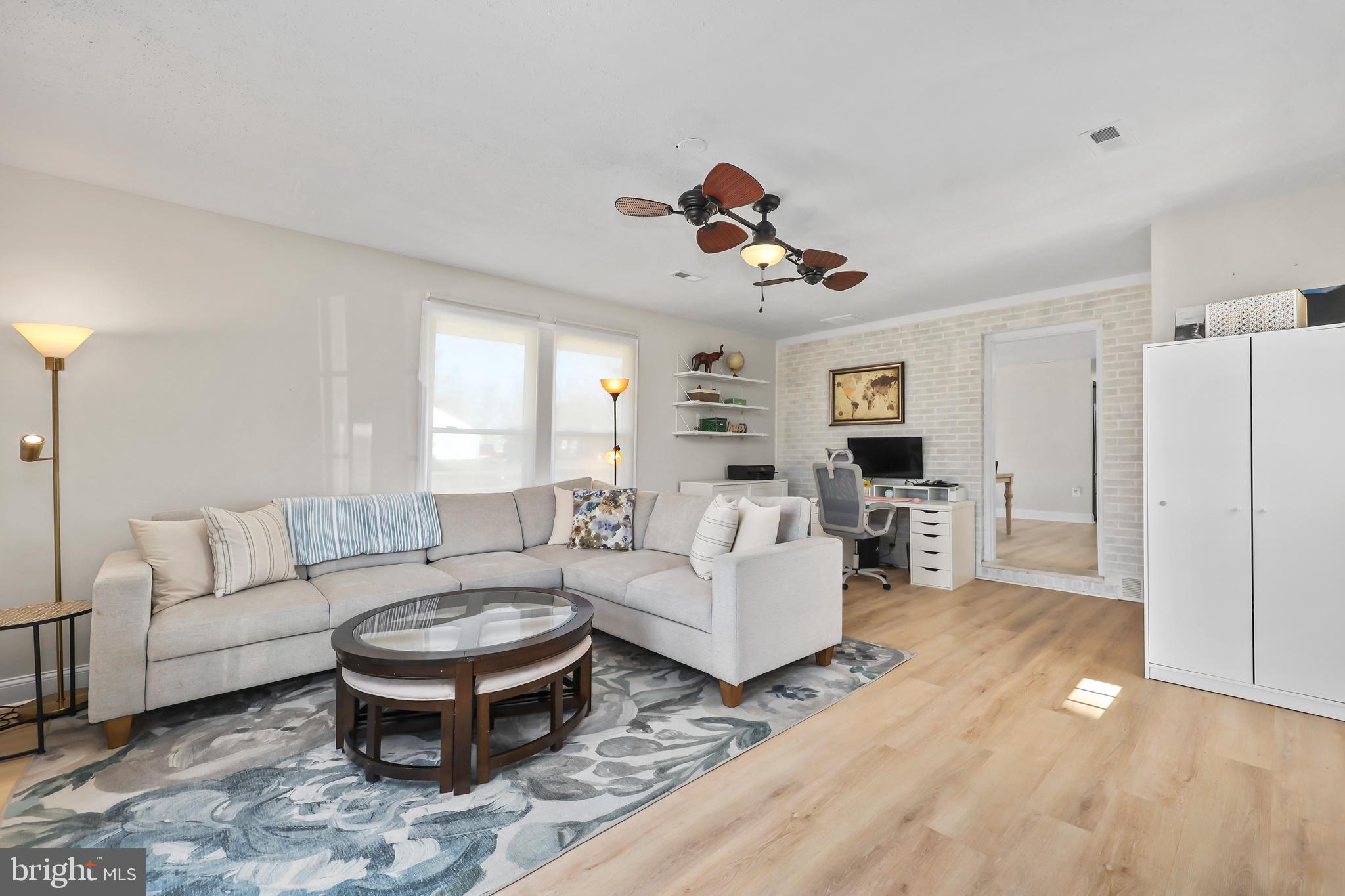 379 Ferry Road Fredericksburg, VA 22405 - Photo 6 of 33 a living room with furniture a rug and a chandelier