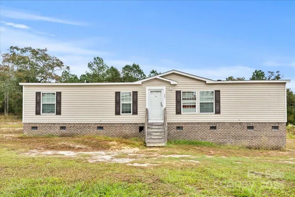 a view of a house with a swimming pool