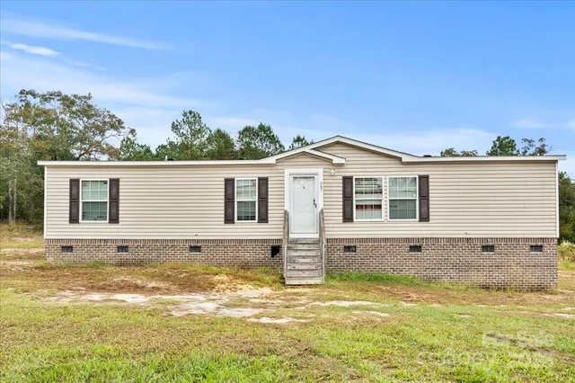 a view of a house with a swimming pool